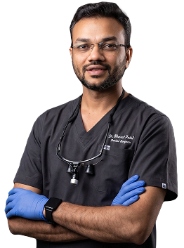 Dr. Bharat R. Patel, cosmetic dentist and certified Ultimate Smile Designer for premium smile design services in Surat